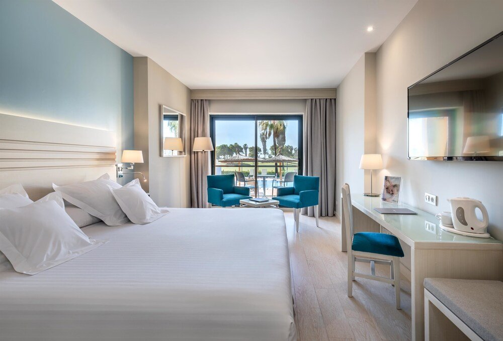 Comfortable hotel room at Barceló Costa Ballena Golf & Spa