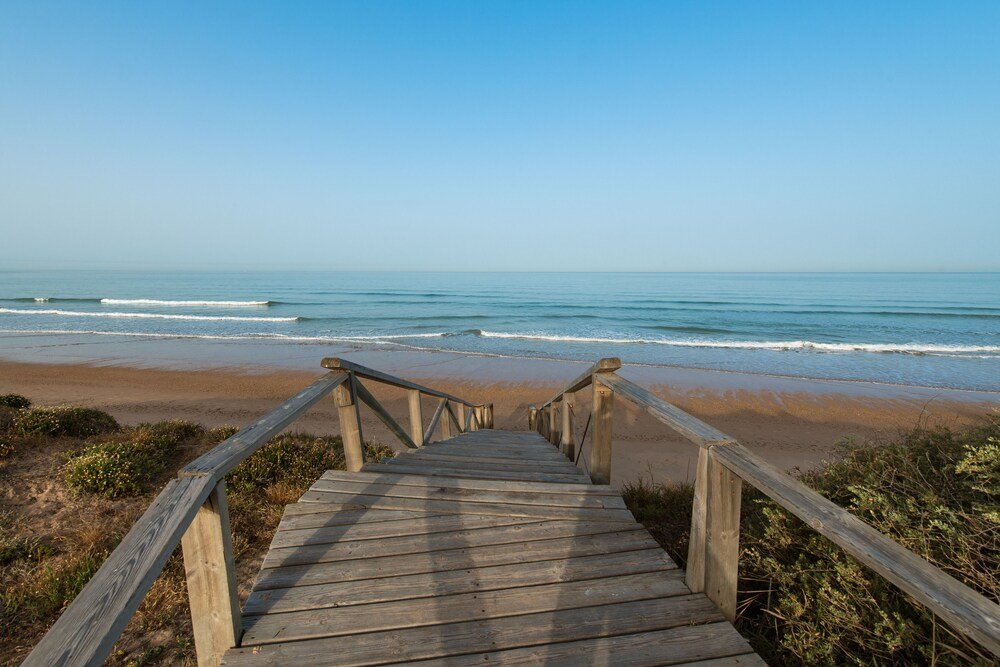 Wooden boardwalk near the resort in Costa Ballena, Rota