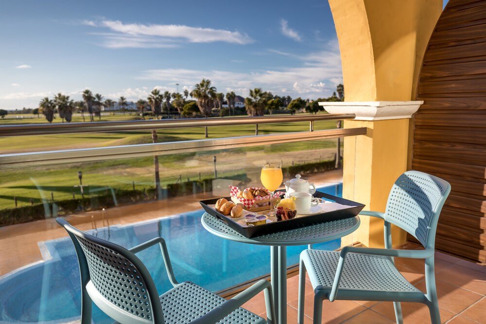 Balcony with a view over the resort pool