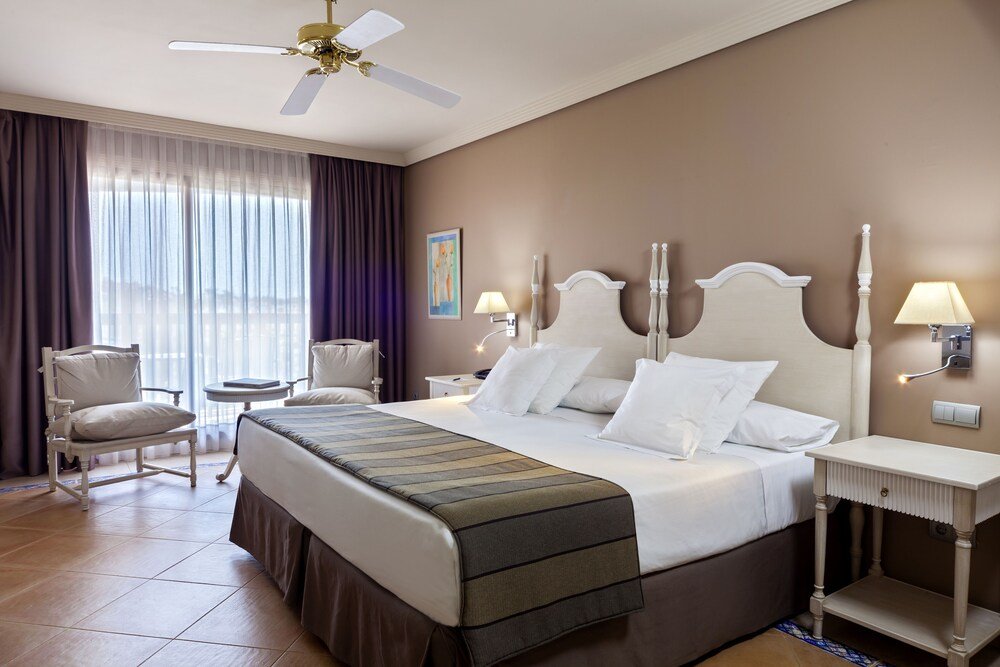Hotel room with a large bed and comfortable furnishings