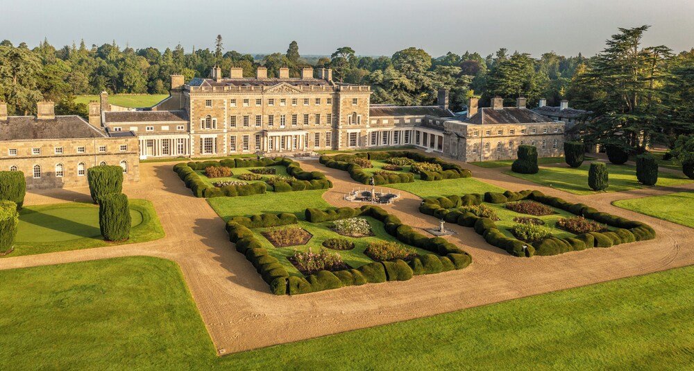 Large historic manor building seen from the grounds