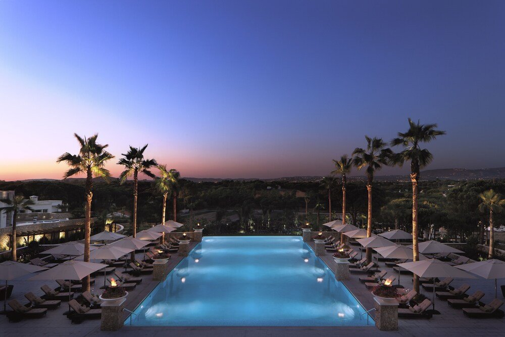 Pool area with lounge chairs at the resort