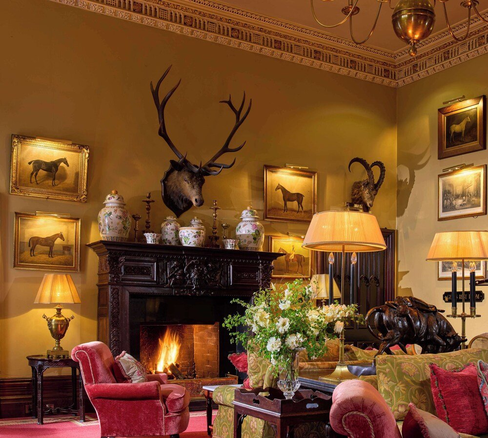 Traditional hotel room with a fireplace at Dromoland Castle, County Clare