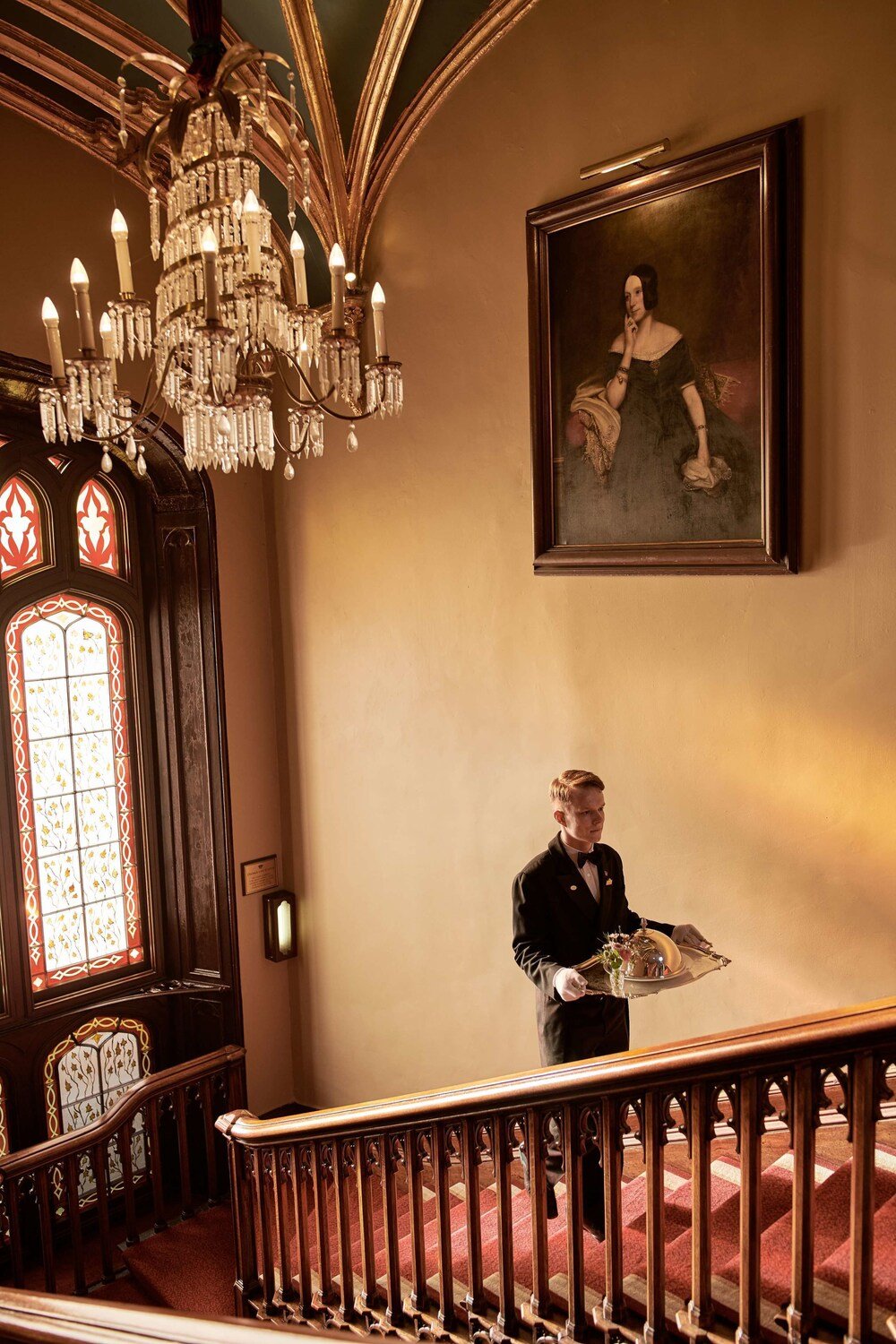Grand staircase with ornate woodwork at Dromoland Castle, County Clare