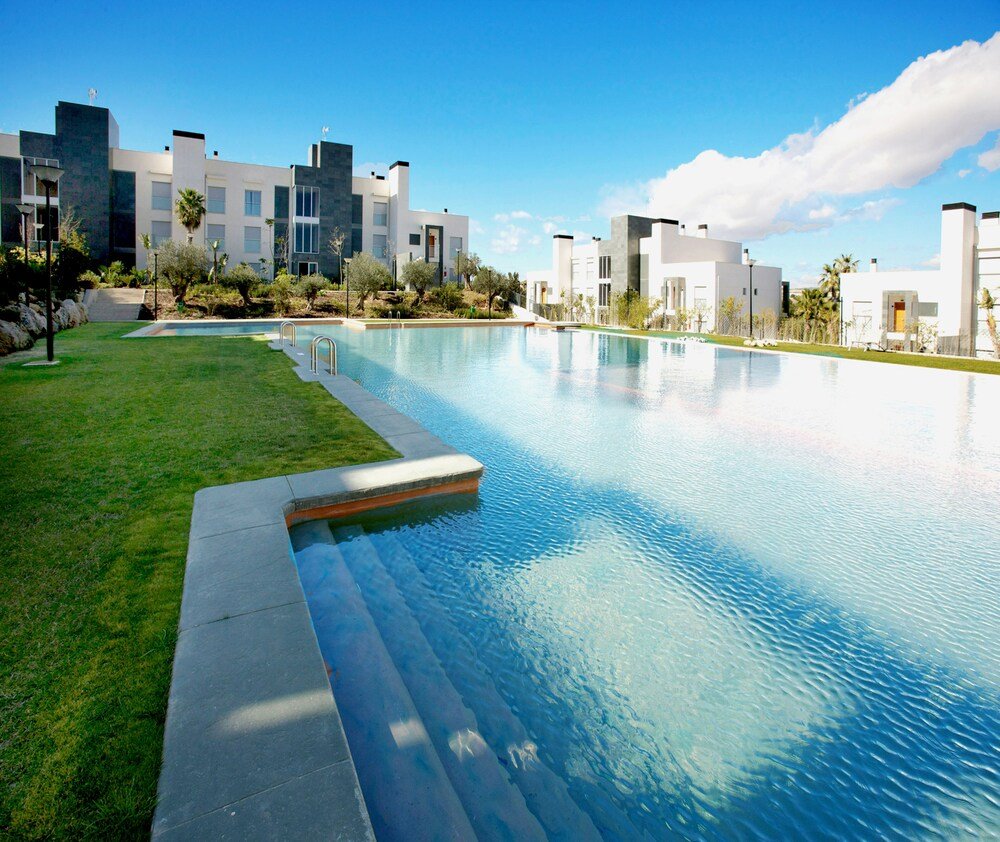 Modern swimming pool at El Plantío Golf Resort