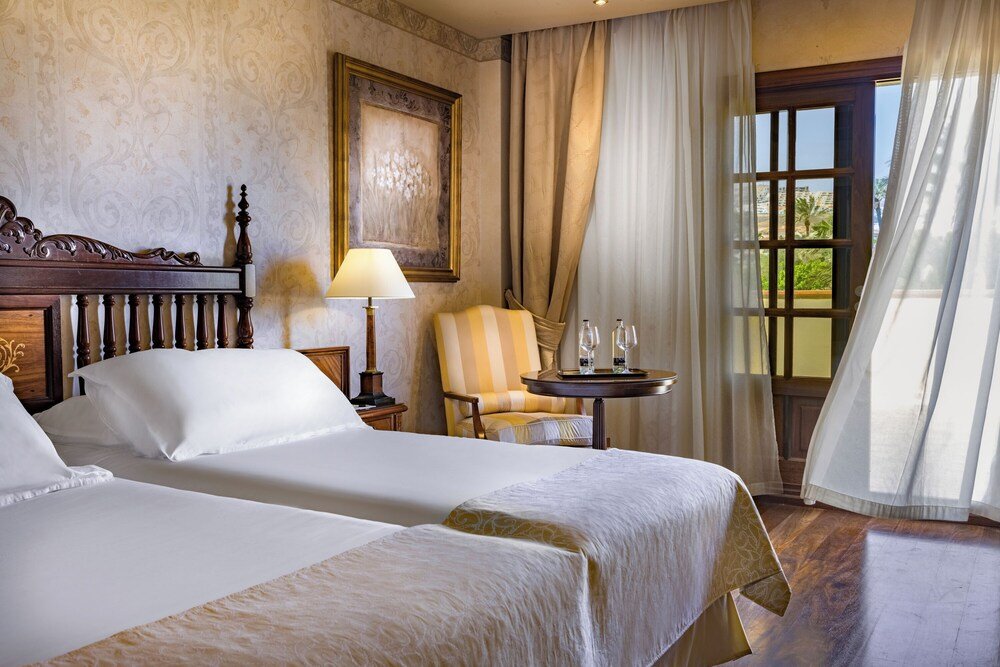 Hotel room with two beds at Elba Palace Golf Boutique Hotel