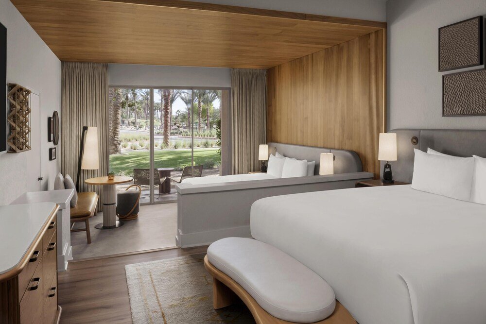 Hotel room with a large bed and desk