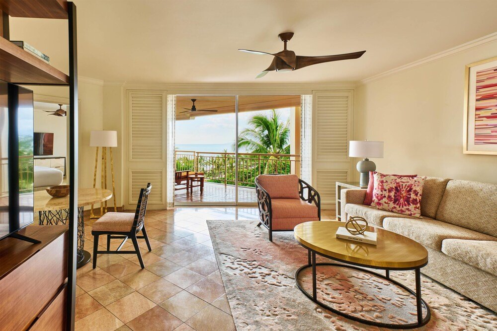 Spacious living room opening onto a balcony at the resort