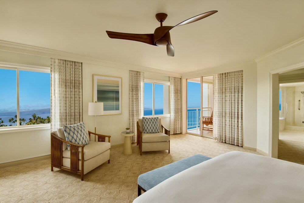 Spacious hotel room with a large bed at the resort