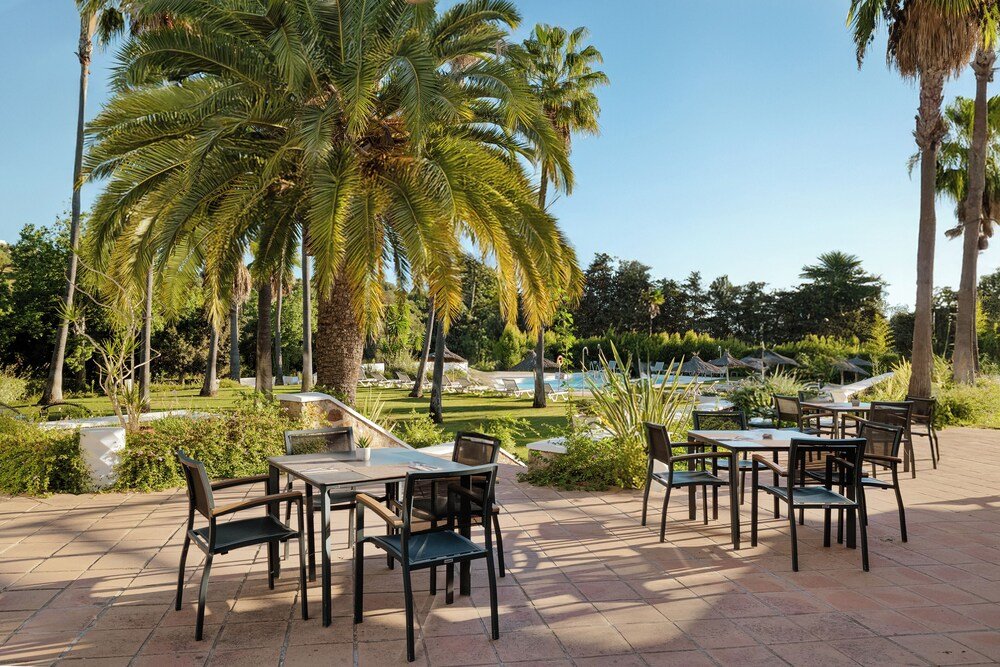 Outdoor patio with tables at the hotel in Sotogrande, Spain