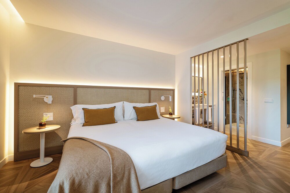 Hotel room with a bed at Hotel Encinar de Sotogrande