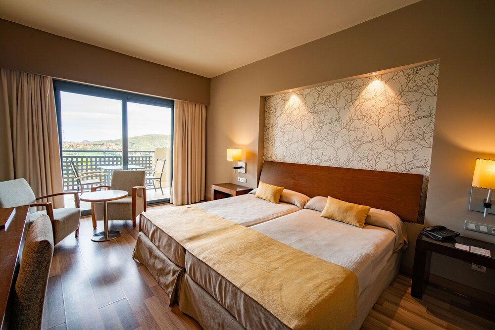 Hotel room with a bed at the Valle del Este hotel