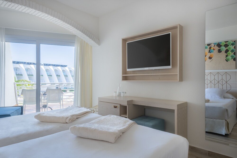 Hotel room with two beds at Iberostar Waves Royal Andalus