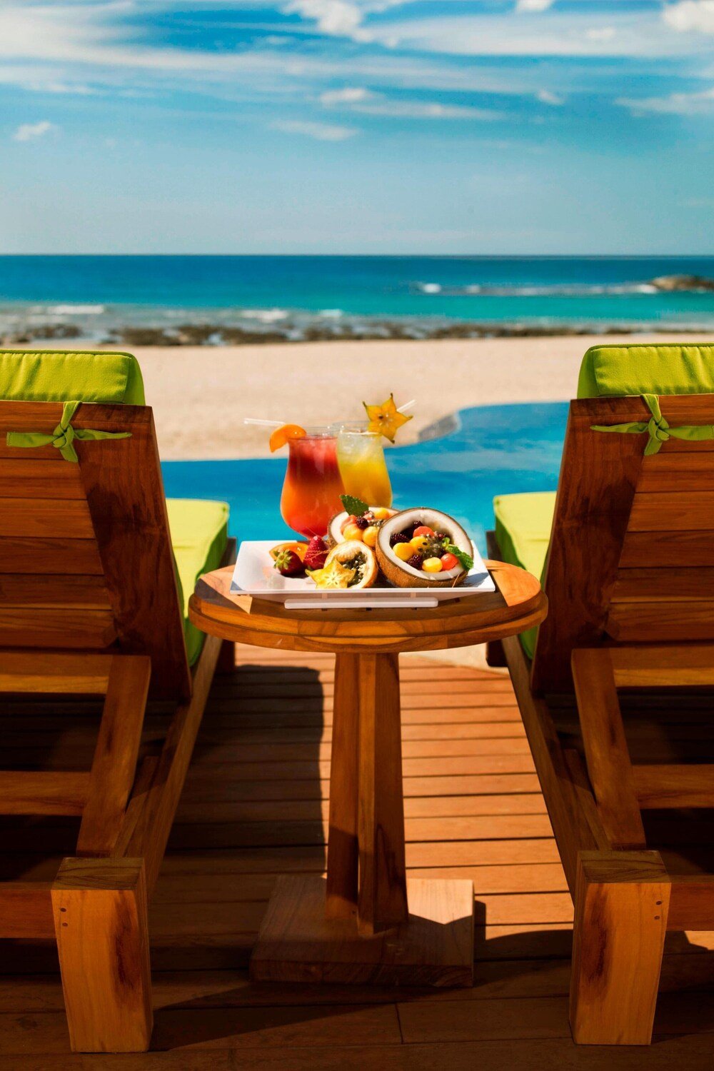 Wooden deck with two chairs at the resort