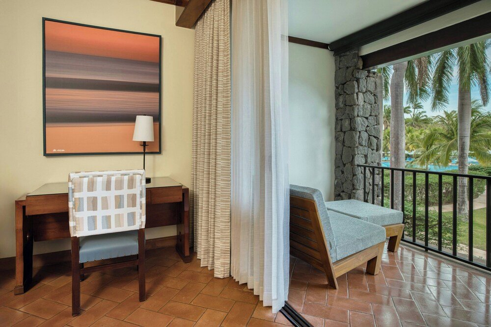Guest room with a desk and a chair