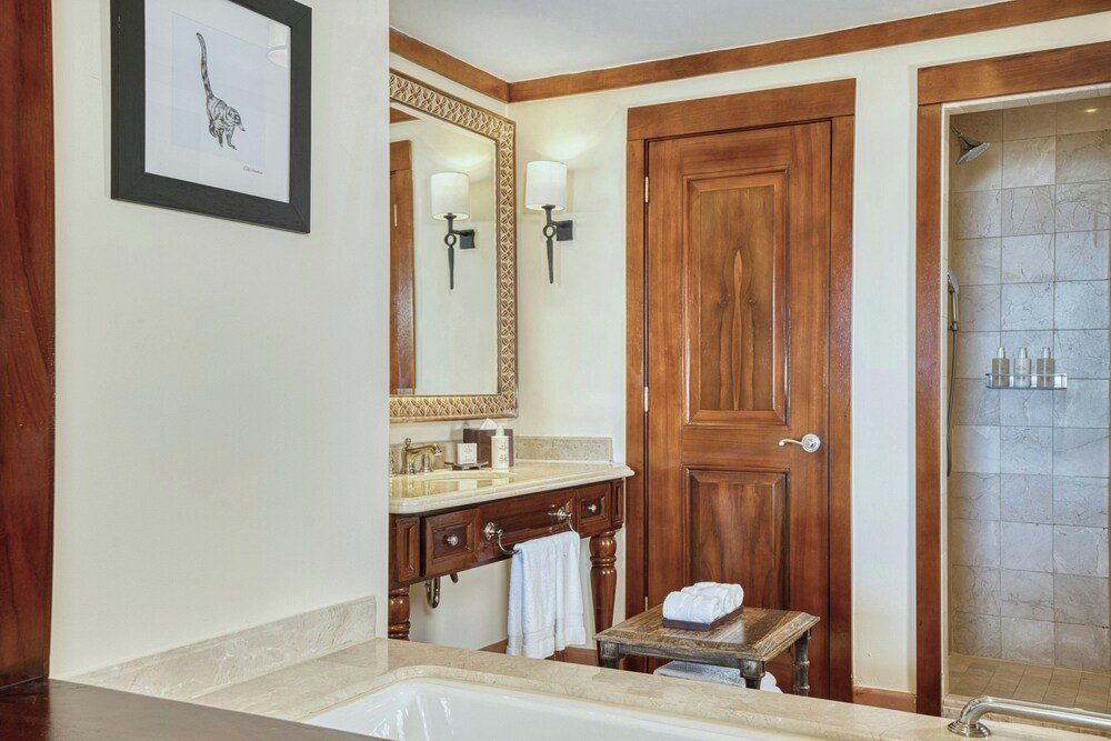 Bathroom with a wooden vanity at the resort