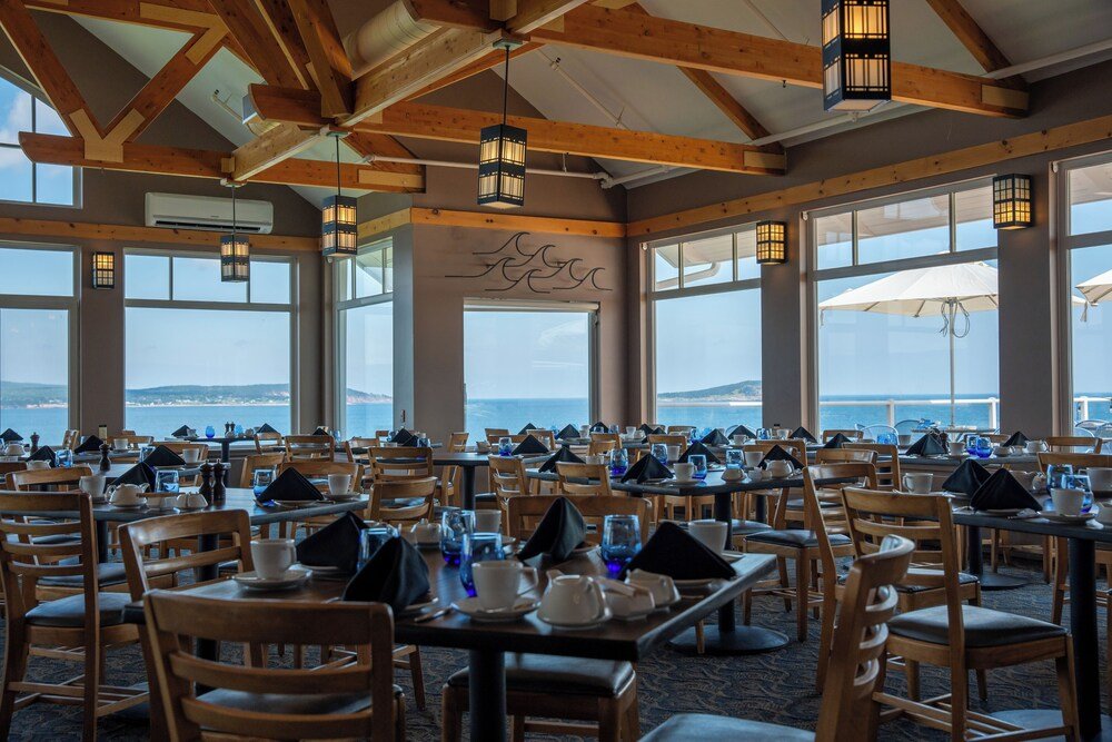 Restaurant with wooden tables and chairs at the resort
