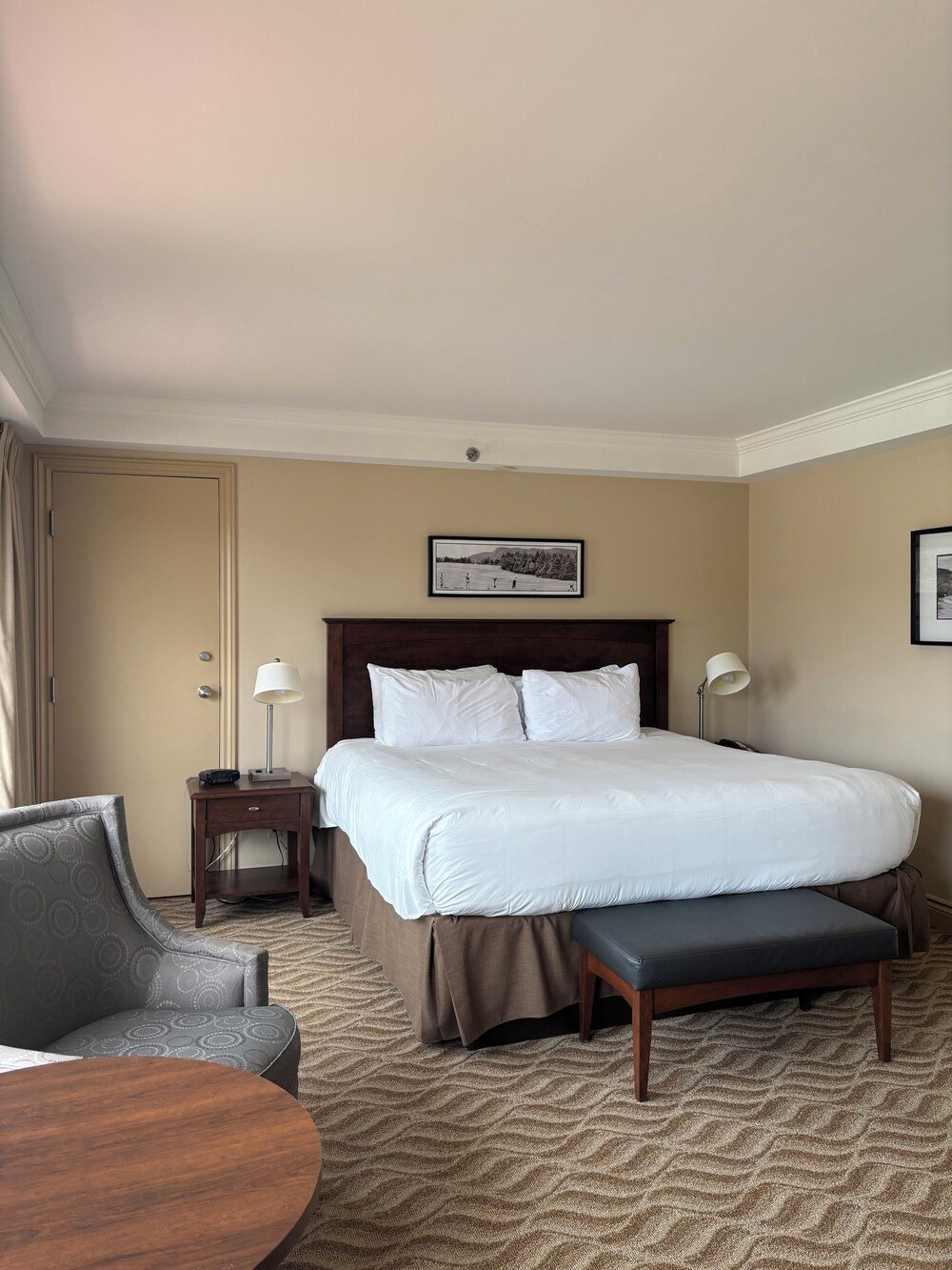 Hotel room with a large bed and bedside tables