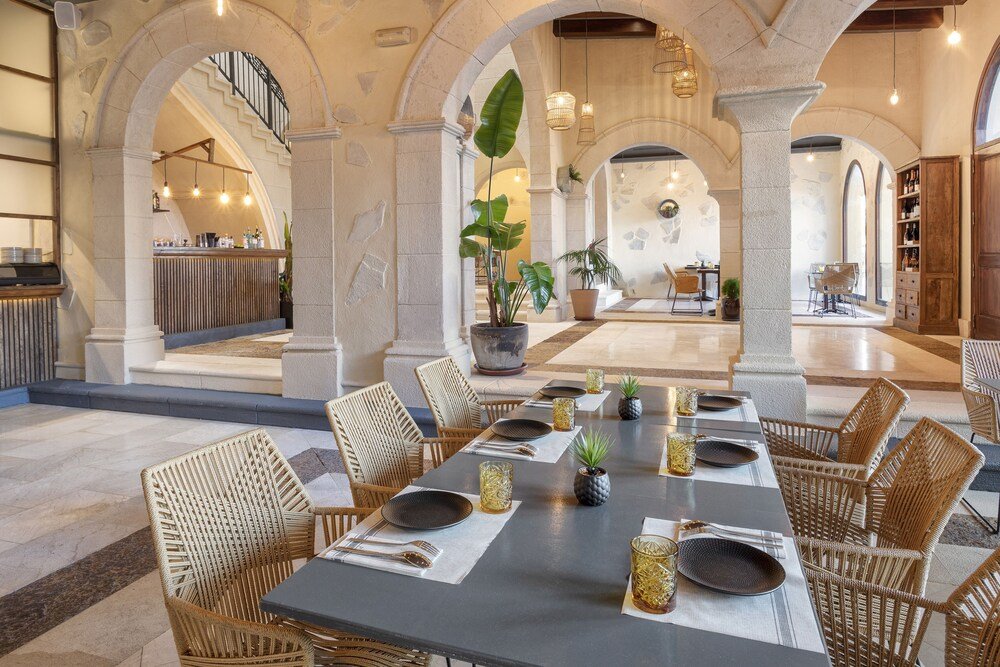 Dining area inside the resort restaurant at Meliá Villaitana