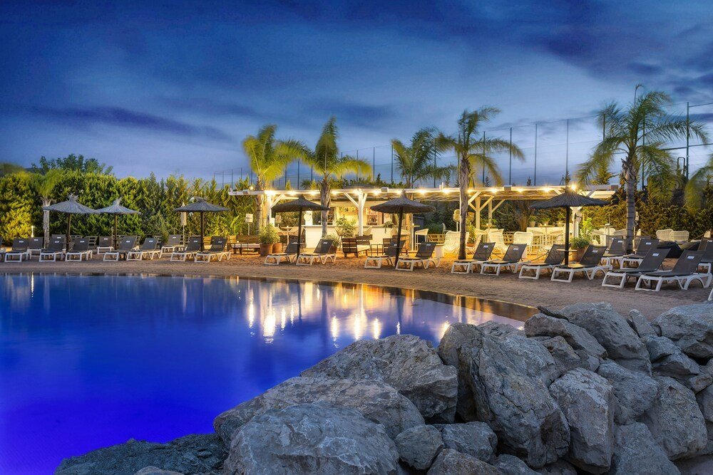 Poolside area with seating at the golf resort