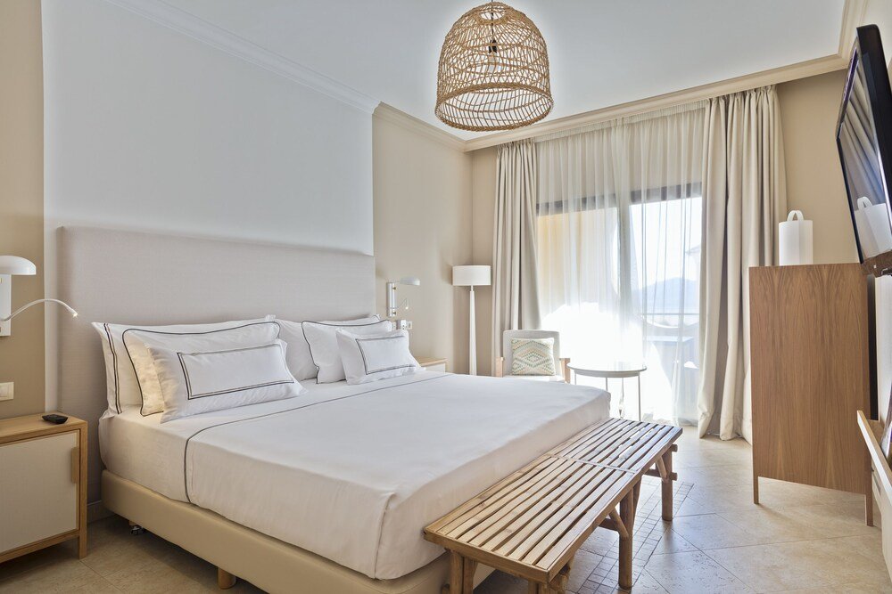Hotel room with a comfortable bed and natural light