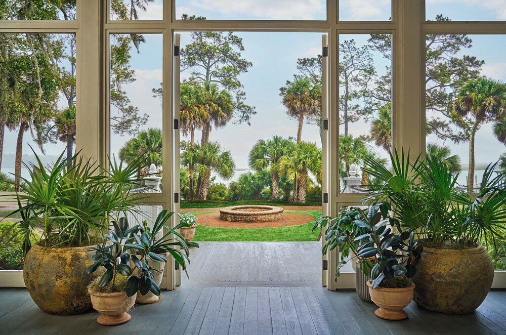 Landscaped garden seen through the large windows of the resort