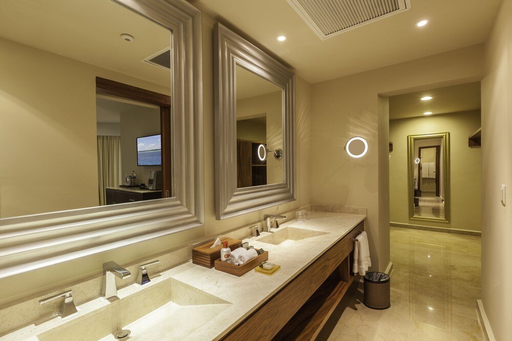 Modern hotel bathroom with a double vanity and two sinks