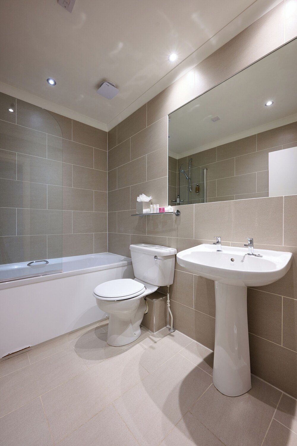 Modern bathroom with a bathtub, toilet and sink