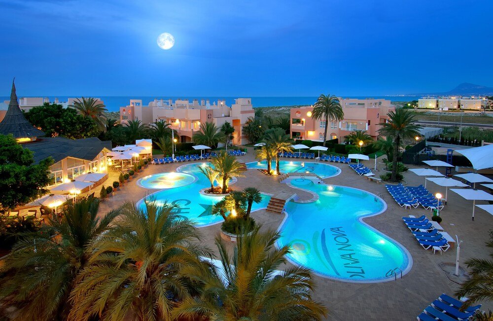 Resort pool area with sun loungers at Oliva Nova Beach & Golf Hotel