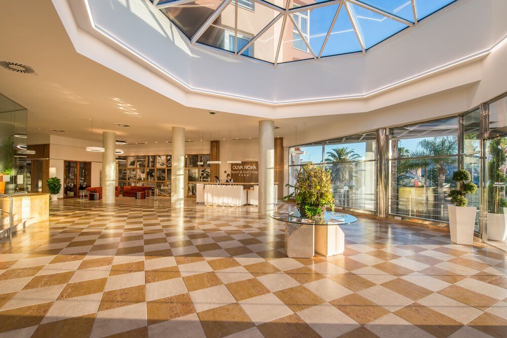 Hotel lobby with seating at Oliva Nova Beach & Golf Hotel