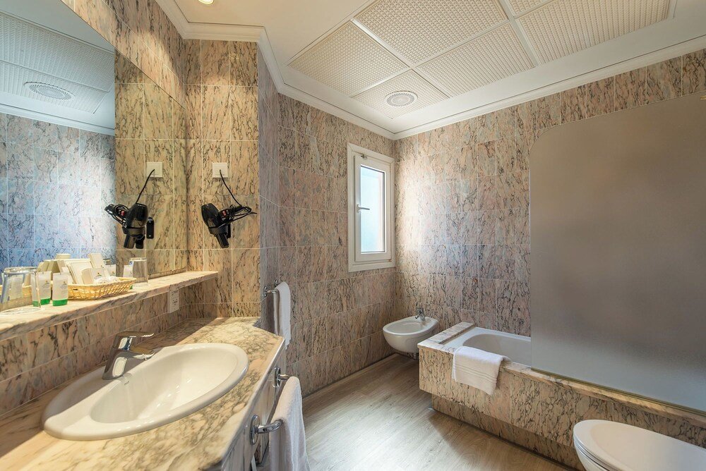 Hotel bathroom with a sink and shower area