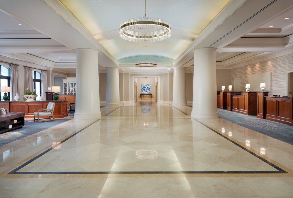 Spacious hotel lobby with a polished marble floor at the resort