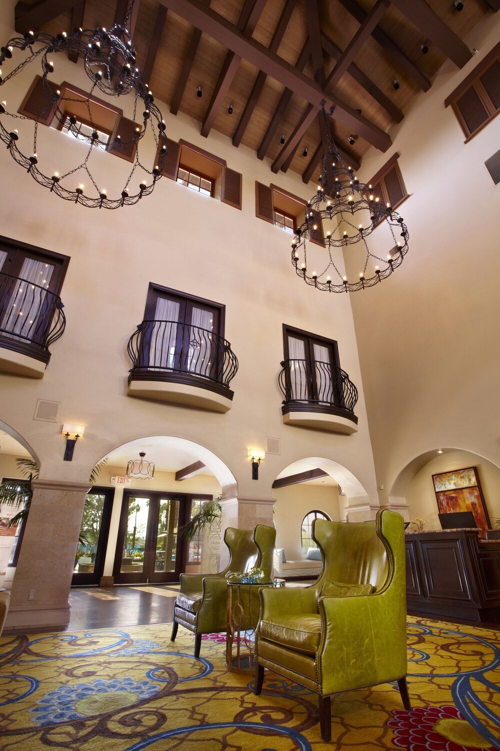 Spacious lobby with high ceilings and a chandelier