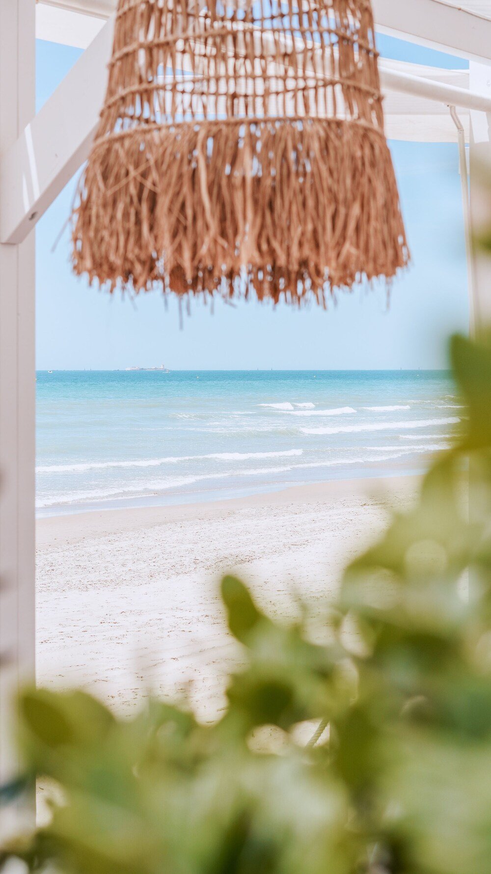 Beach view seen through a window at the Gran Meliá resort