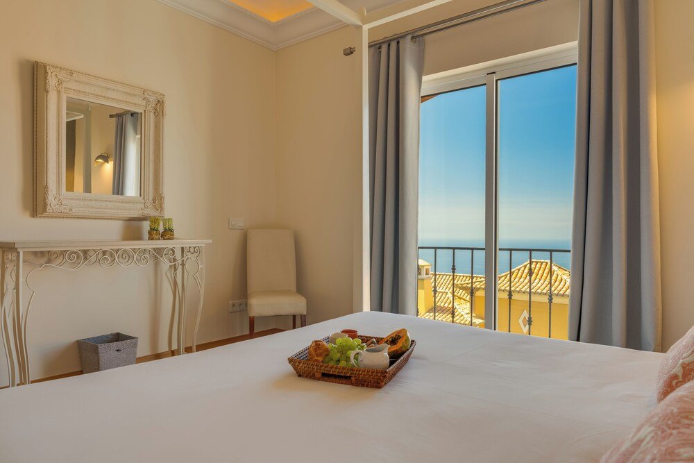 Hotel room with a large window and natural light