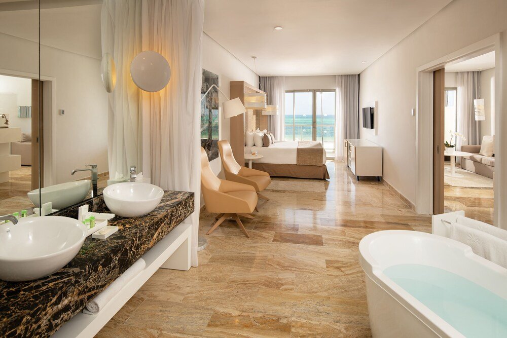 Modern hotel room with a comfortable bed at Paradisus Palma Real in Bávaro, Punta