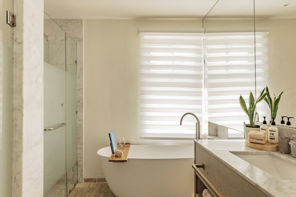 Modern bathroom with a large vanity at Paradisus Palma Real in Bávaro, Punta Cana