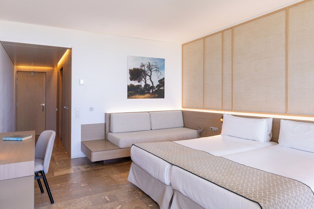 Hotel room with a bed and soft lighting