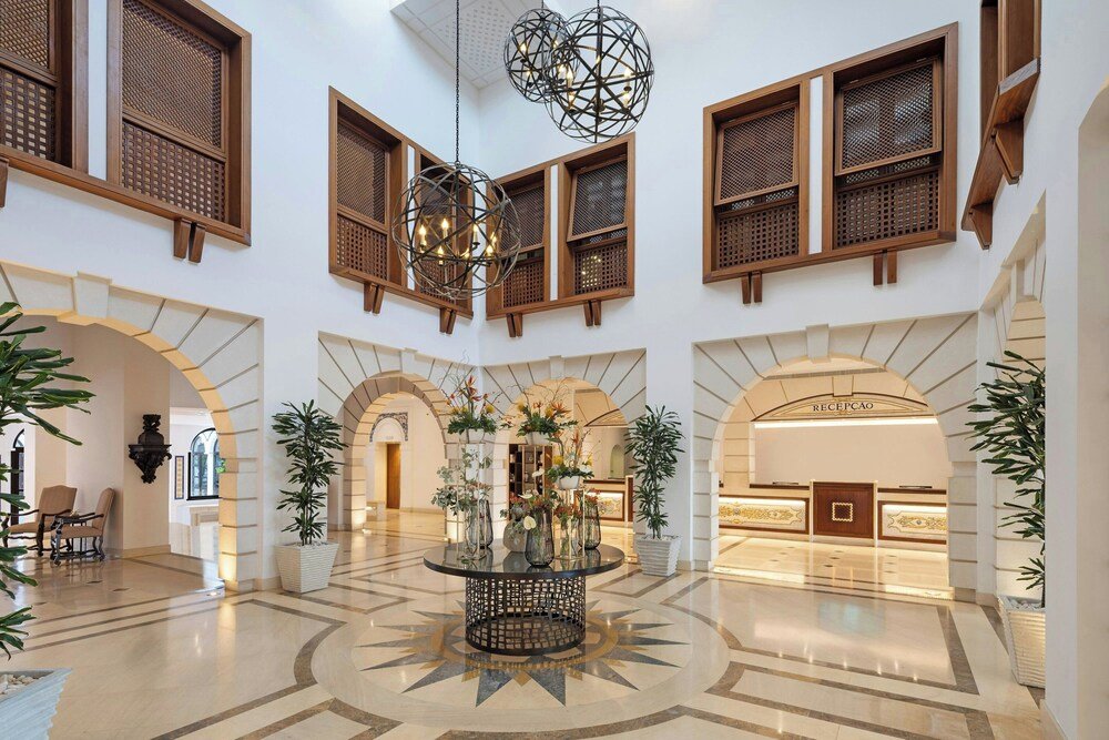 Lobby with a chandelier at Pine Cliffs Resort in Albufeira, Algarve