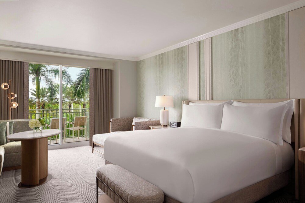Guest room with a large bed and sitting area