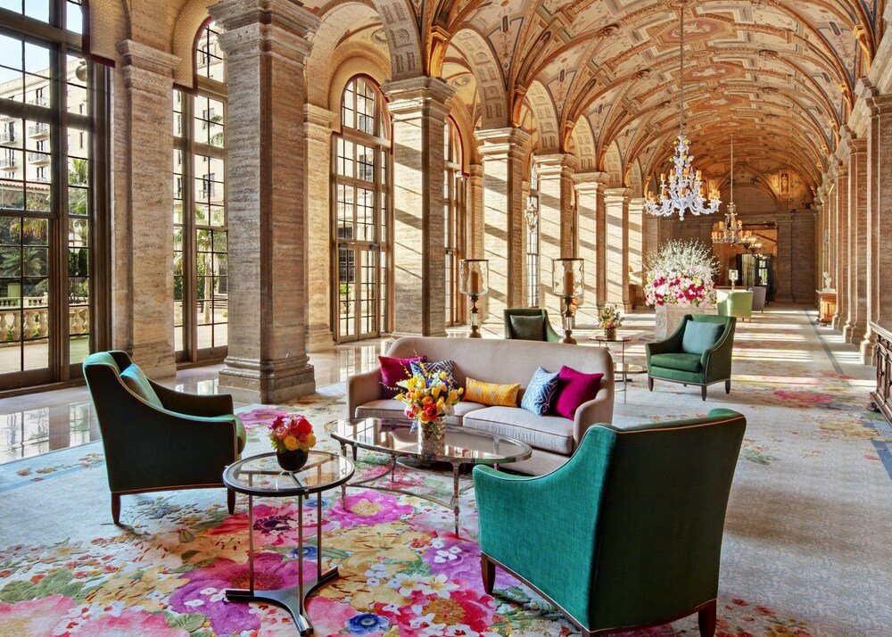 Grand hallway with high ceilings and large windows