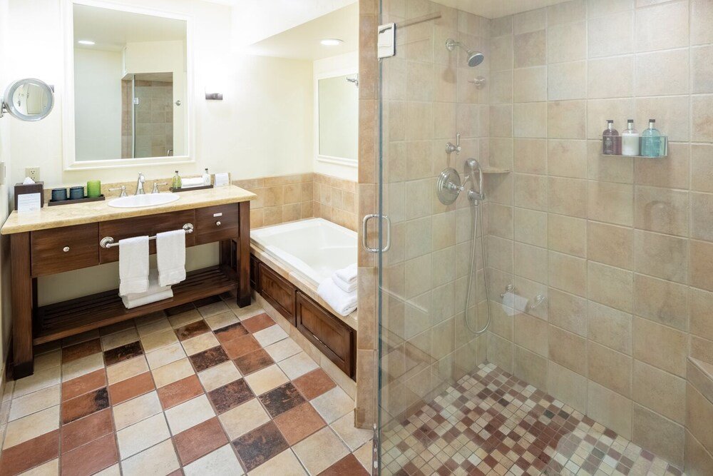 Bathroom with a sink and mirror at The Quail