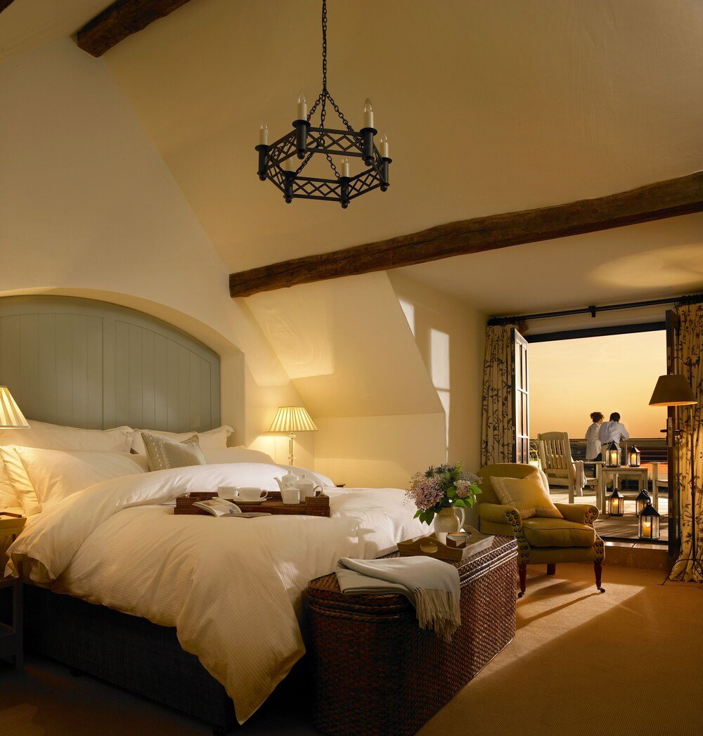 Spacious bedroom with a comfortable bed at Trump Doonbeg