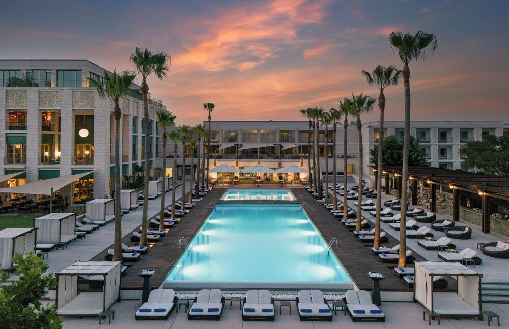 Hotel building overlooking a large swimming pool at Victoria Golf Resort
